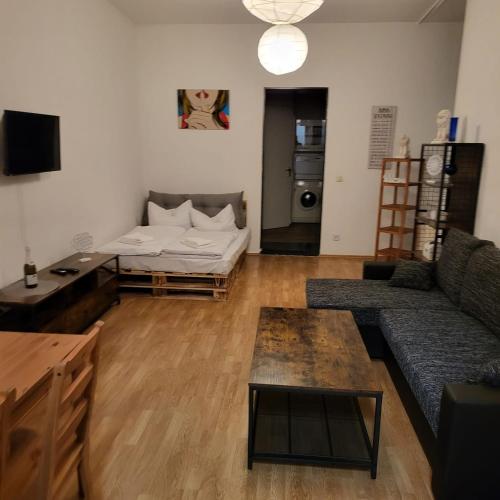 a living room with a couch and a table at Apartment Cozy B66 - Nähe Alexanderplatz in Berlin