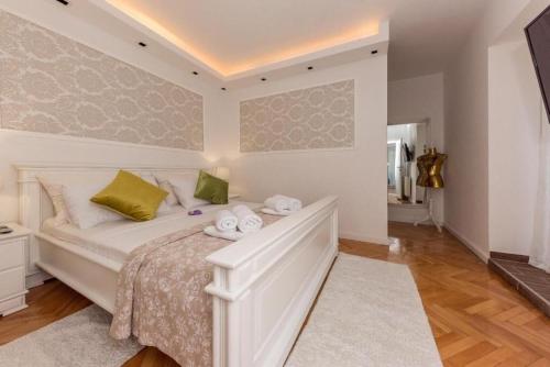 Ένα ή περισσότερα κρεβάτια σε δωμάτιο στο Apartments Wellness & Beauty