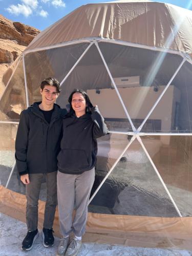 a man and a woman standing in a tent at Rum titanic camp in Wadi Rum