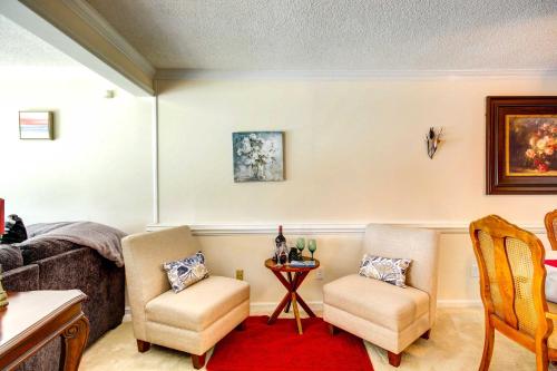 a living room with two chairs and a table at Waterfront Vacation Rental on Savannah River! in Augusta