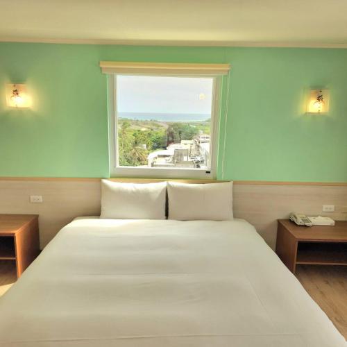 Postel nebo postele na pokoji v ubytování Apple Hotel