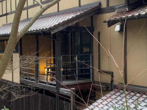 a building being constructed with scaffolding on the front of it at Ryokan Nushiya in Gotsu