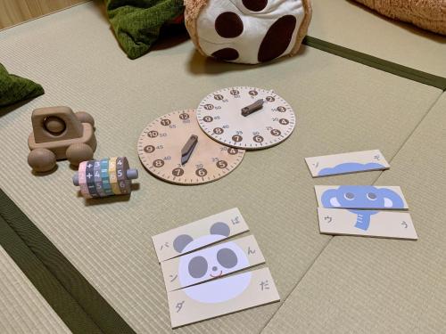 a table topped with clocks and a soccer ball at Ryokan Nushiya in Gotsu