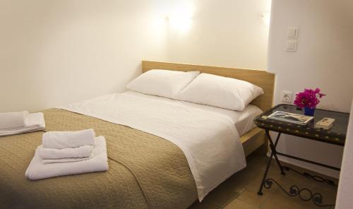 Katil atau katil-katil dalam bilik di Heliotropio Studios & Apartments