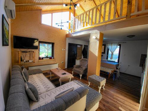 a living room with a couch and a table at Vila Mila Fruška Gora in Velika Remeta