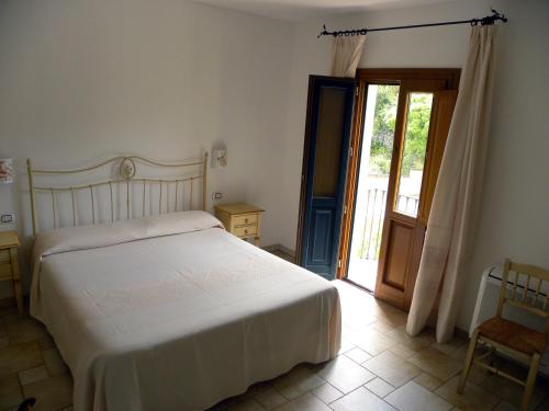 Ένα ή περισσότερα κρεβάτια σε δωμάτιο στο Hotel San Pantaleo
