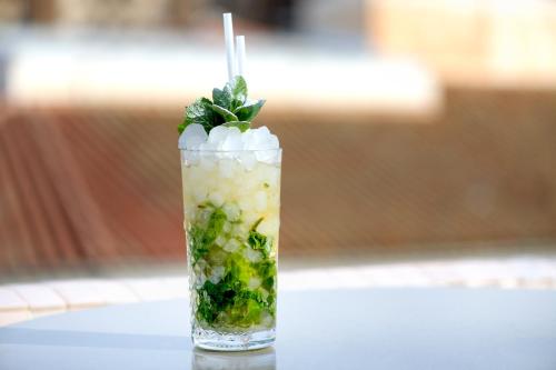 a drink with greens and ice on a table at Hotel Larios Málaga in Málaga