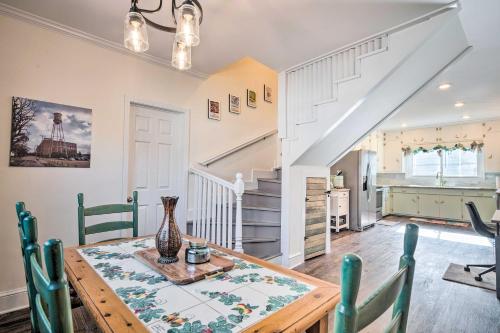 a kitchen and dining room with a table and chairs at Greenville Escape with Deck and Fire Pit! in Greenville
