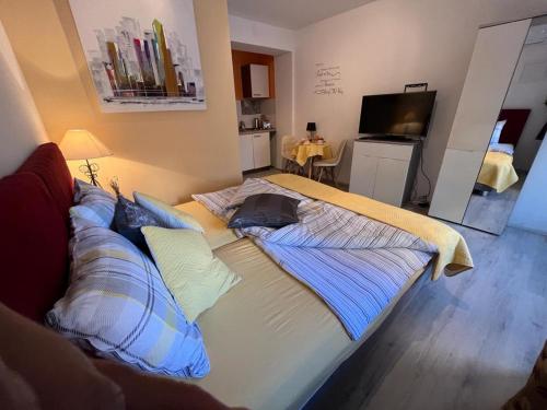 Un ou plusieurs lits dans un hébergement de l'établissement Titius Apartment