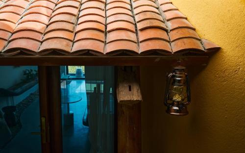 a window with a roof with a light on it at Barbados Cherry Villa in Hoi An