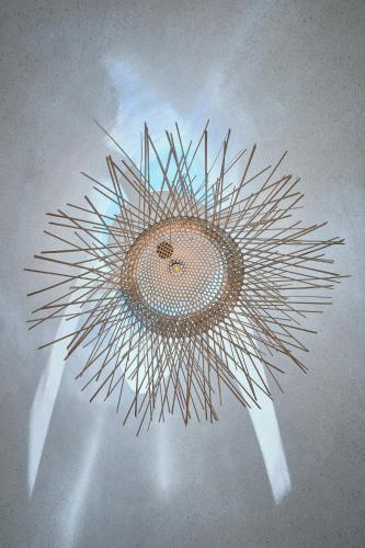 a ceiling light with a circular design on a ceiling at Barbados Cherry Villa in Hoi An