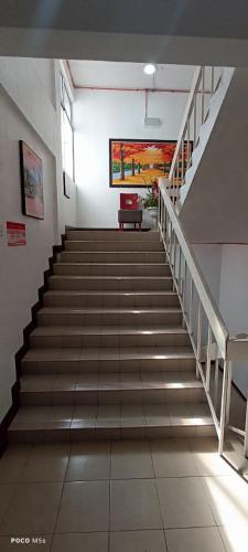 a staircase in a building with a stair case at ASLAH BOUTIQUE HOTEL in Kota Bharu