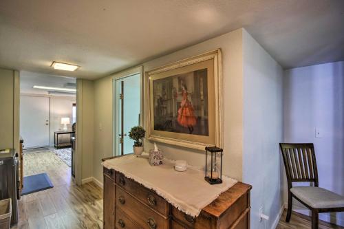 a room with a table with a painting on the wall at Billings Apartment with Fireplace and Smart TV in Billings
