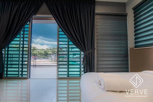 a bedroom with a bed and a view of the ocean at Ipoh MJ Boutique House by Verve (20pax) EECH79 in Ipoh
