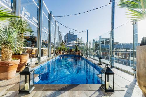 an indoor pool on the floor of a building at Virgin Hotels London - Shoreditch in London