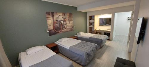 Katil atau katil-katil dalam bilik di Hotel Amado