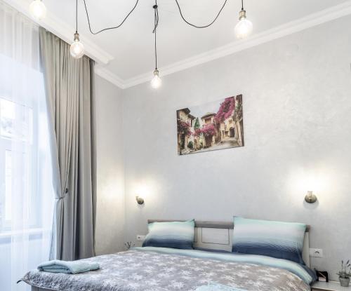 Postel nebo postele na pokoji v ubytování Golden Rose ! Apartments Lviv S