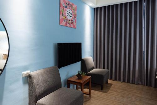 TV a/nebo společenská místnost v ubytování Tianli Hotel