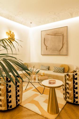 a living room with a couch and a table at Nerva Boutique Hotel in Rome