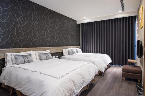 Postel nebo postele na pokoji v ubytování Tianli Hotel