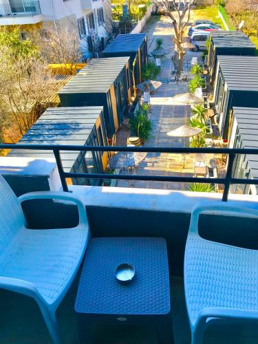 a blue bench sitting on top of a balcony at Hotel Barba in Urla