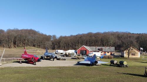 a bunch of old planes parked in a field at Rosdala gård - gästhuset in Rydsgård