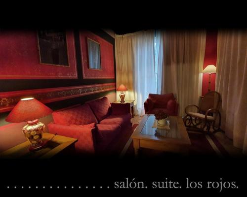 a living room with a couch and a table at Casona Camino Real De Selores in Selores