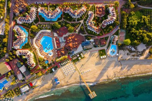 an aerial view of a resort with a beach at TUI BLUE Pascha Bay in Konaklı