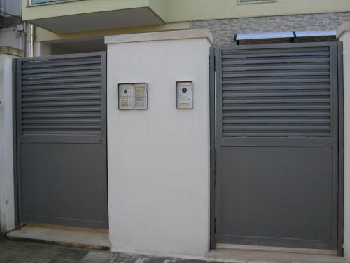 a pair of garage doors in a building at B&B Li Figuli in Lecce