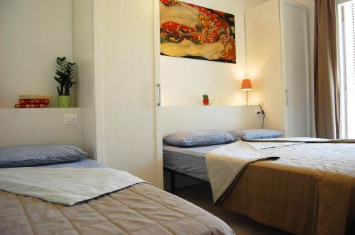 A bed or beds in a room at Relaxing apartment in a village with swimming pool