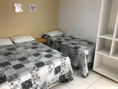 Un ou plusieurs lits dans un hébergement de l'établissement Pousada Unique Porto de Galinhas