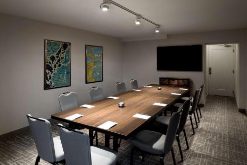 a conference room with a large wooden table and chairs at Hyatt Regency San Antonio Riverwalk in San Antonio