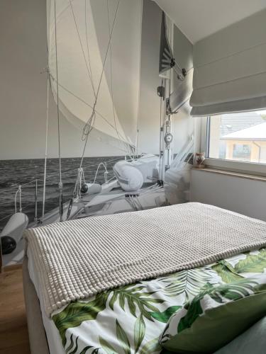 a bedroom with a bed on a boat at Boya Home in Wilkasy