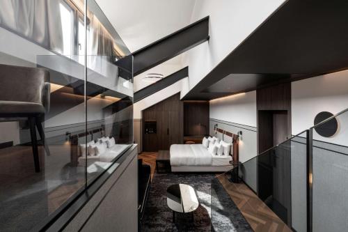 a hotel room with a bedroom with a bed at Radisson Collection Hotel, Palazzo Touring Club Milan in Milan