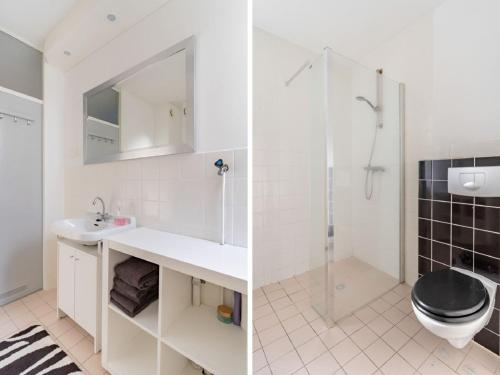 a bathroom with a toilet and a sink and a shower at Apartment in Alkmaar with sea beach in Alkmaar