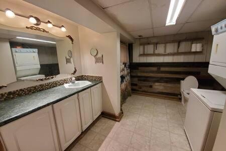 a large bathroom with a sink and a toilet at Five Star Ranch in Milton