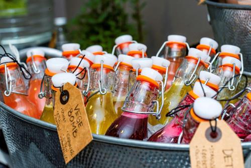 a bucket full of bottles of drinks with signs in it at Park Inn by Radisson Oslo Airport Hotel West in Gardermoen