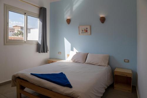 Postel nebo postele na pokoji v ubytování Al Deira Dahab Hotel