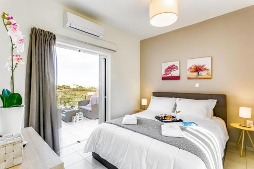 Posteľ alebo postele v izbe v ubytovaní Cyan Icons Villas Kalyves Chania