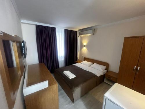 Postel nebo postele na pokoji v ubytování Яссы hotel, Turkistan
