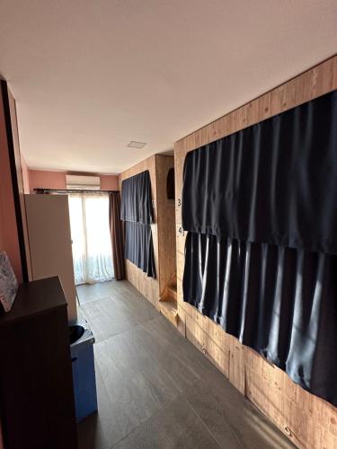 a room with a wall with black curtains at Archeo in Istanbul