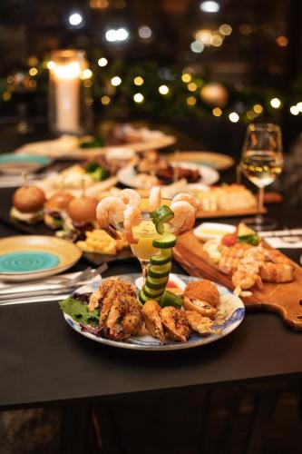 a table with a plate of food on a table at Ankars Suites & Hotel in Ramallah