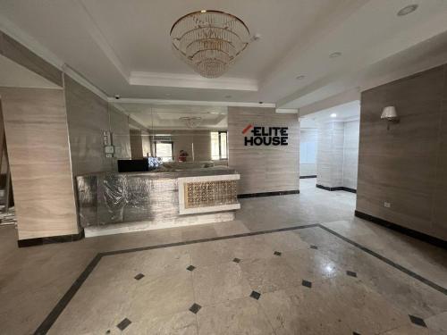 a large lobby with a large mirror in a building at 3-room elite apartment Alexandria in Bishkek