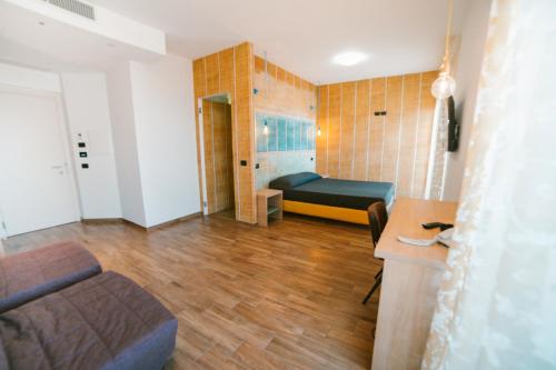 En eller flere senge i et værelse på Hotel Continental