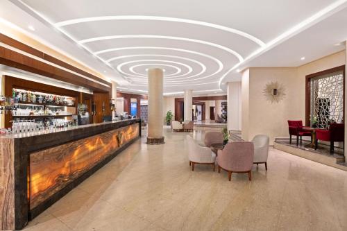 a lobby of a hotel with a bar at Rixos Premium Seagate in Sharm El Sheikh