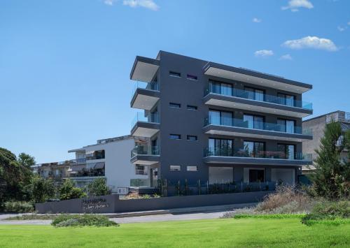 a rendering of a black apartment building at Light Blue Hotel in Nea Kalikratia