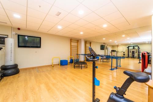 a gym with treadmills and machines in a room at Vistamar Hotel Luxury Wellness By DLV -Adults Only- in Villajoyosa