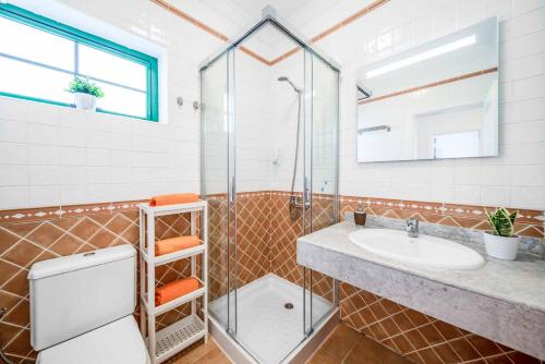 a bathroom with a sink and a shower at Villa Mero in Playa Blanca