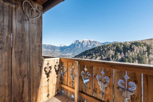 a balcony with a view of the mountains at Aschnerhof Holzhitt in Collalbo