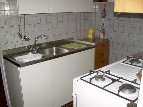 Kuchyň nebo kuchyňský kout v ubytování Appartamenti Bernardo I